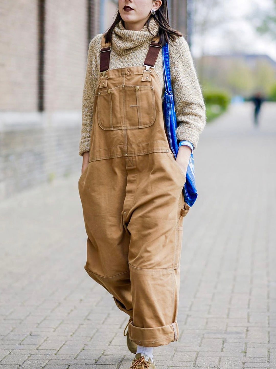 Beige canvas overalls worn outdoors
