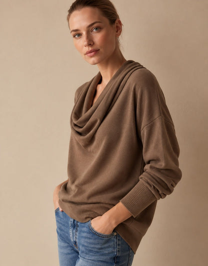 Woman wearing a brown cowl neck knit pullover sweater