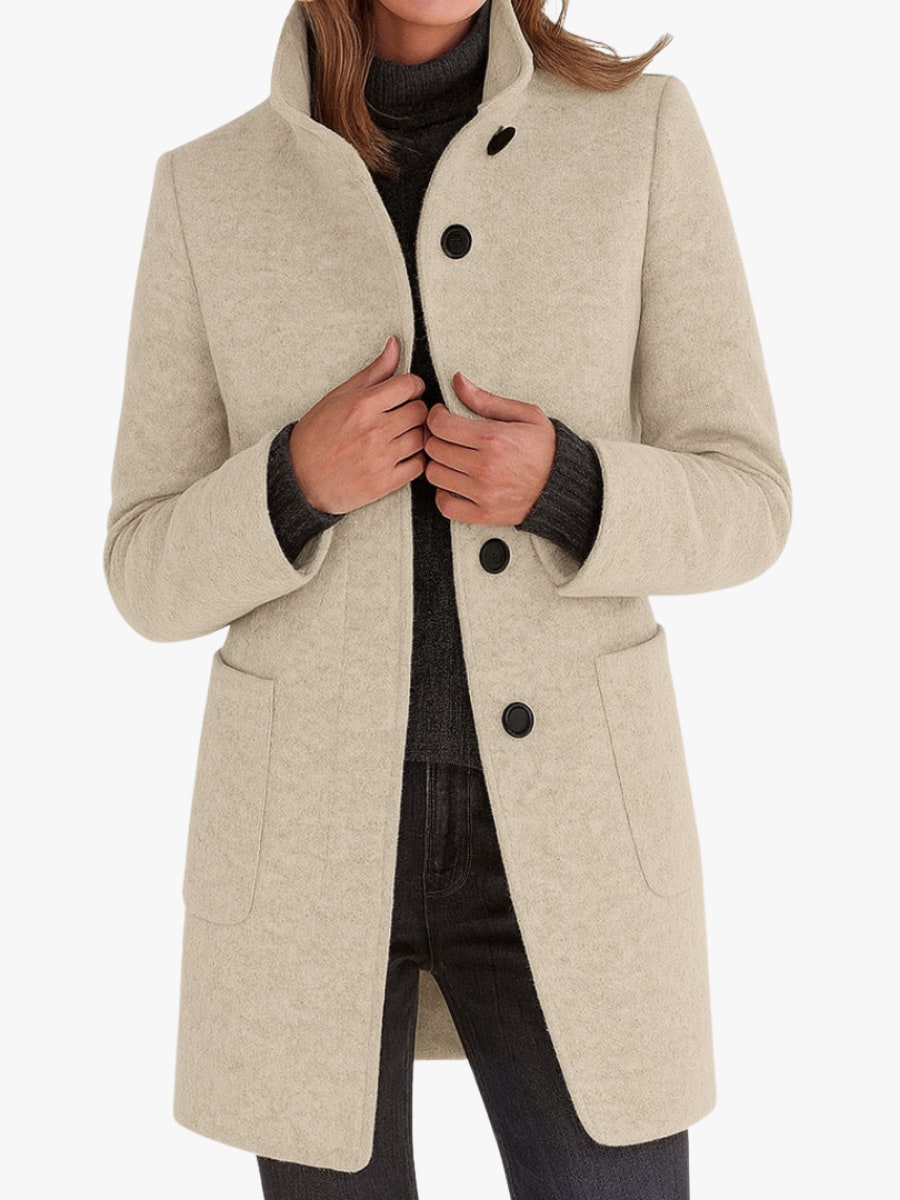 Woman wearing a cream wool-look coat with a stand collar