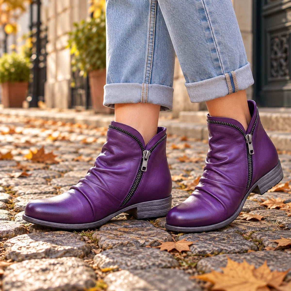 Purple ankle boots on cobblestones
