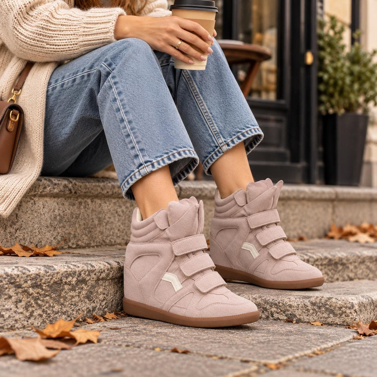 Pink hidden wedge sneakers worn with jeans