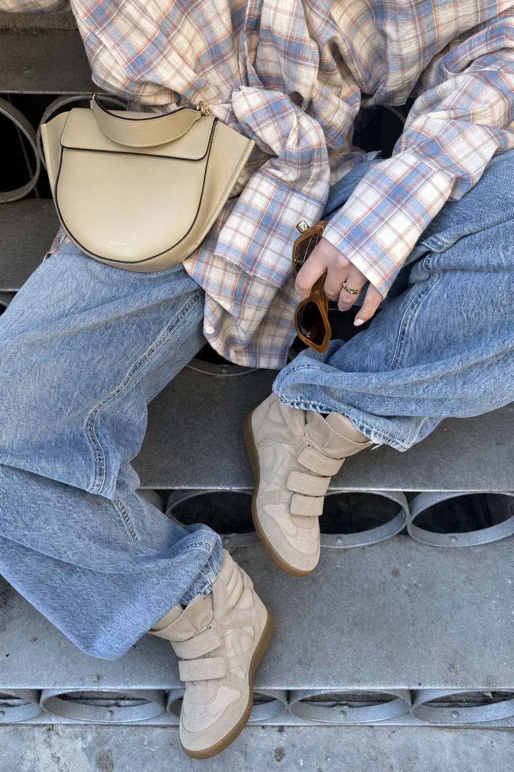 Beige hidden wedge sneakers styled with jeans