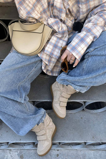 Beige hidden wedge sneakers styled with jeans