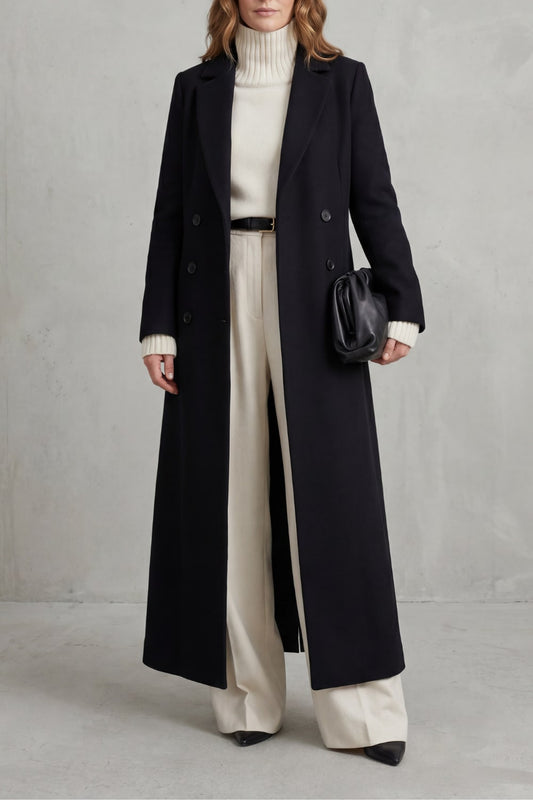 Woman wearing a black long tailored coat