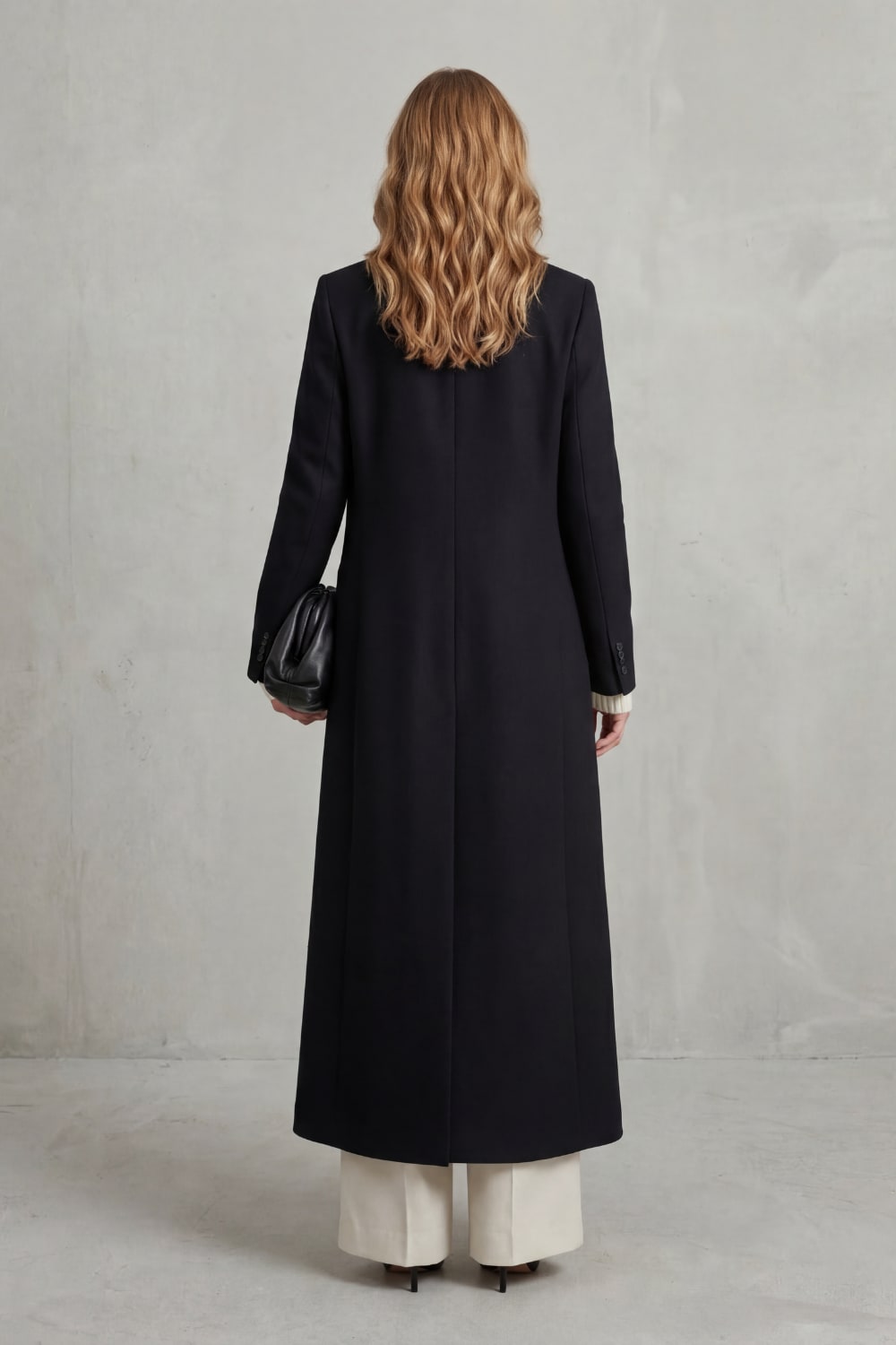 Black long tailored coat, back view