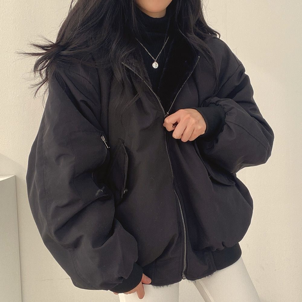 Black reversible jacket worn open