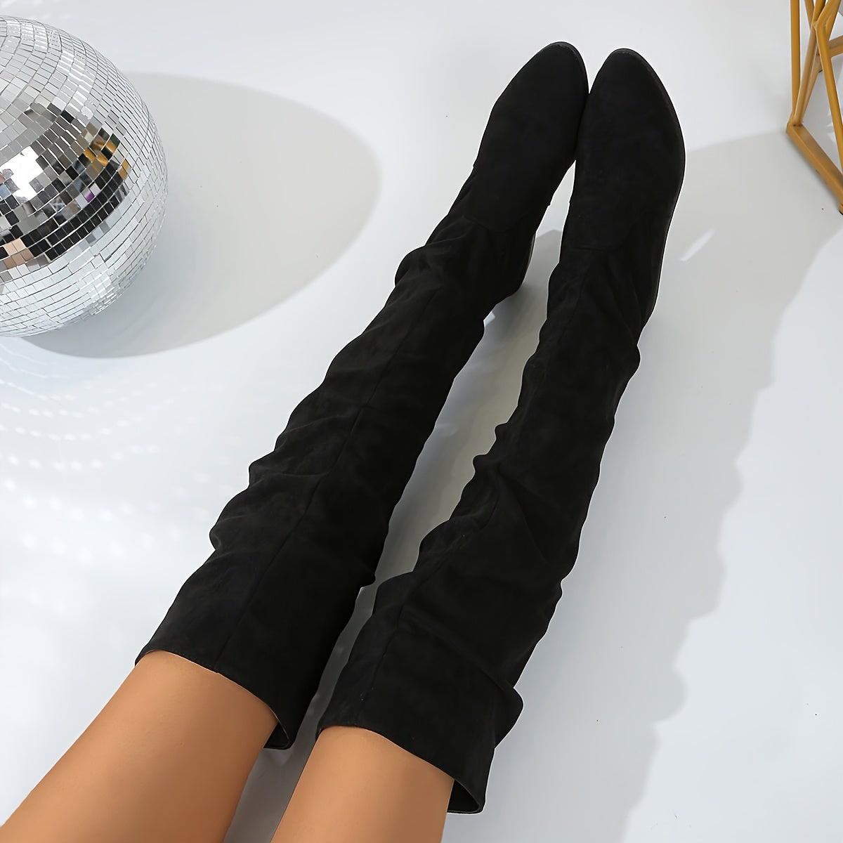 Black over-the-knee boots, close view