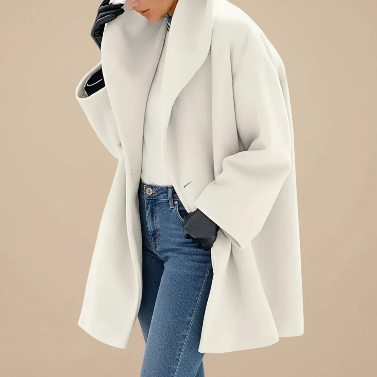 Woman wearing a white oversized A-line coat