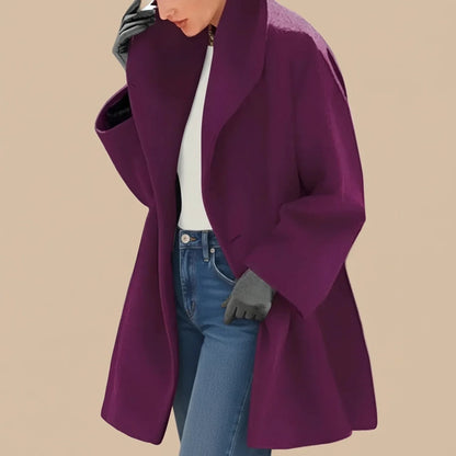 Woman wearing a purple oversized A-line coat