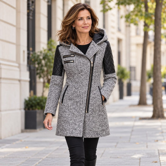 Woman walking in a light grey winter jacket with quilted black sleeves