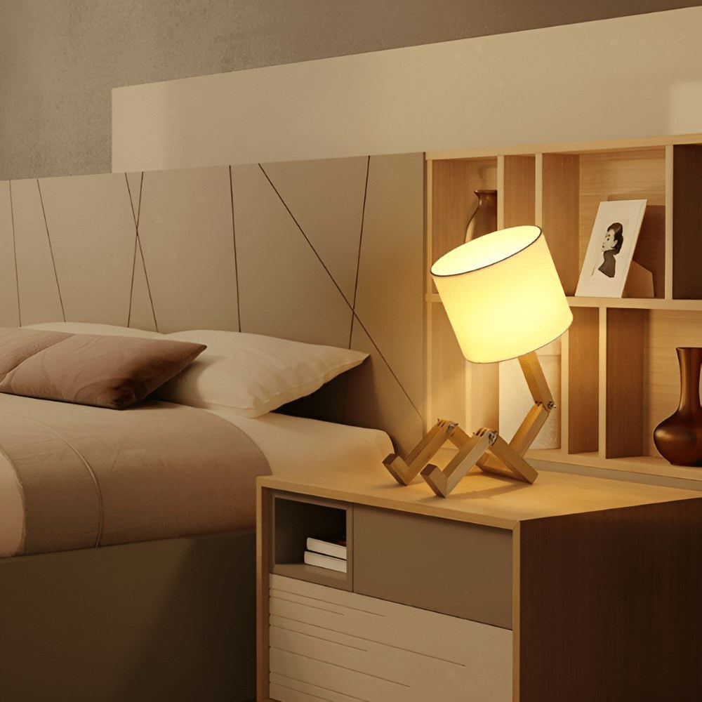 Wooden robot lamp on a bedside table
