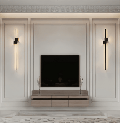 Slim linear LED wall light mounted above a seating area