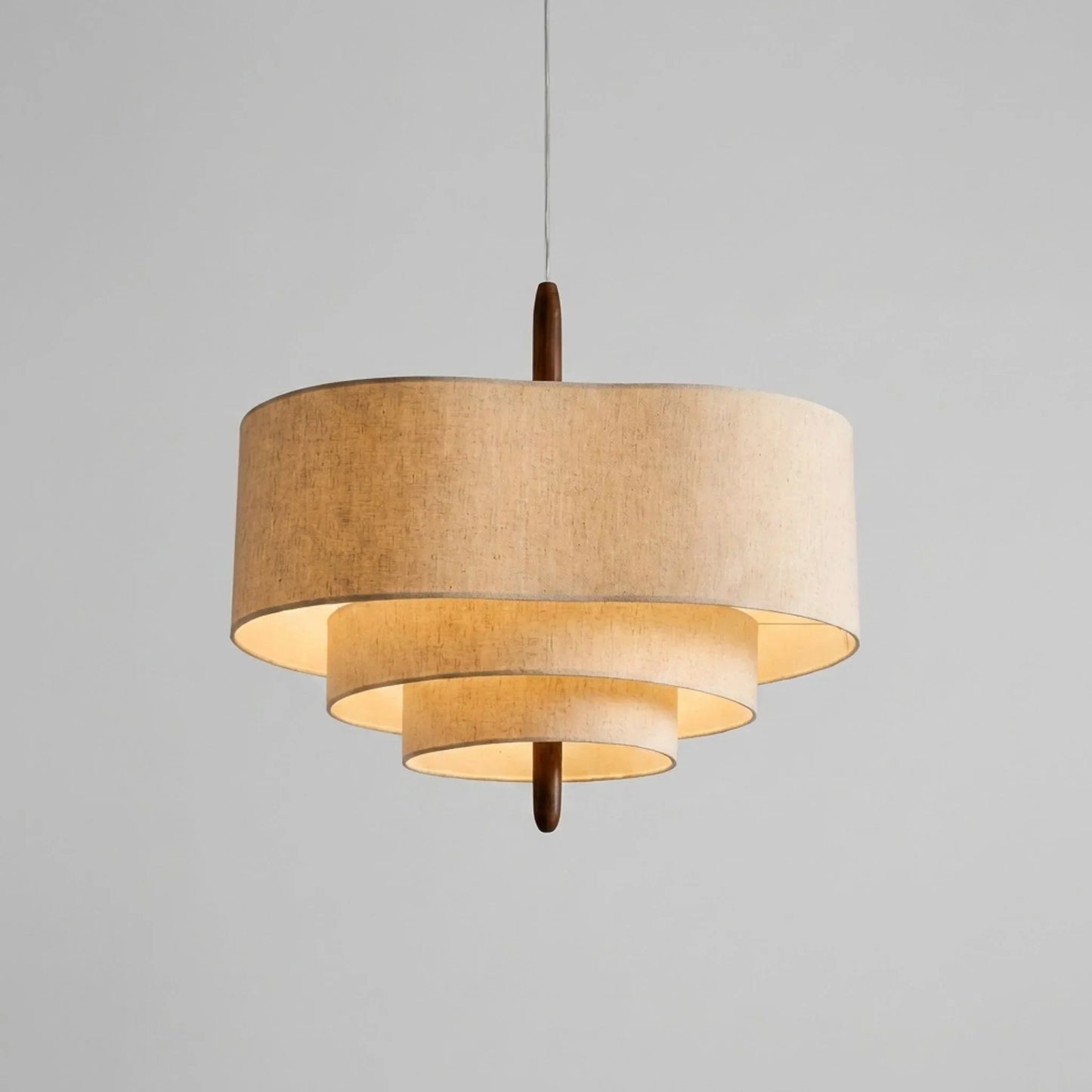Tiered woven pendant light shown against a plain grey background